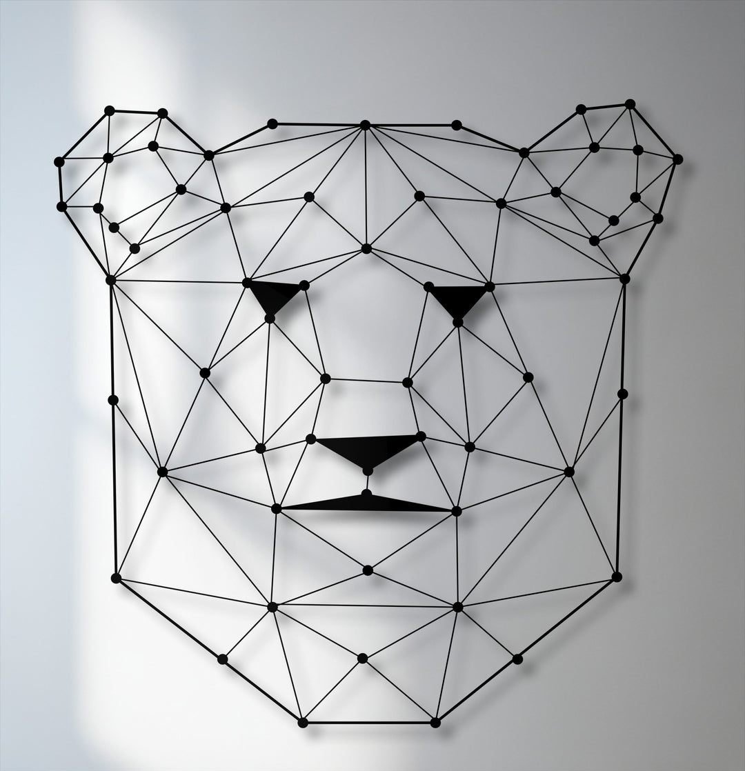 The foreground detail reveals a striking geometric bear face, crafted from interconnected black lines and dots, creating unique metal art for wall decor.