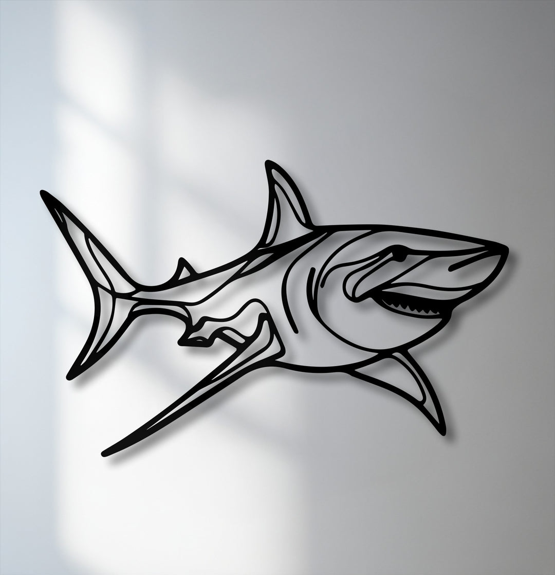 The brightest area of the white wall beautifully highlights the sleek lines of this dynamic shark metal artwork, creating a striking contrast.