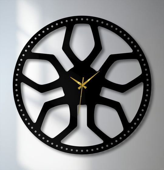 Subtle light and shadow define the intricate black metal abstract radial pattern of this modern geometric decoration wall art clock.