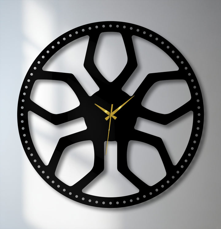 Subtle light and shadow define the intricate black metal abstract radial pattern of this modern geometric decoration wall art clock.