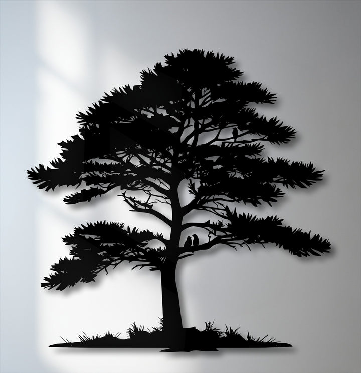 The sharp angles and jagged edges of the pine tree silhouette create a compelling decorative metal art piece against a soft gray background.
