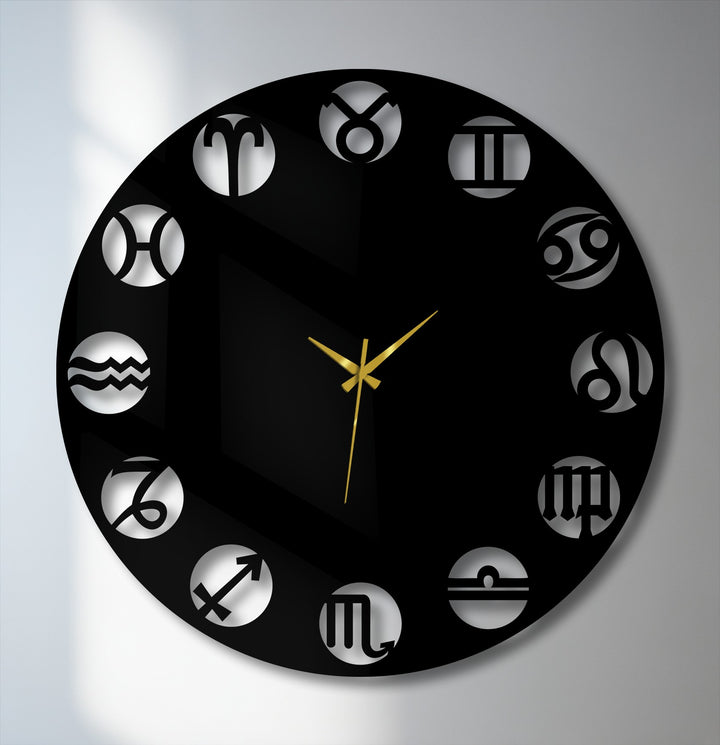 Sleek black metal art for wall, a circular Zodiac Symbol Metal Wall Clock with intricate gold hands and cutout astrology designs.