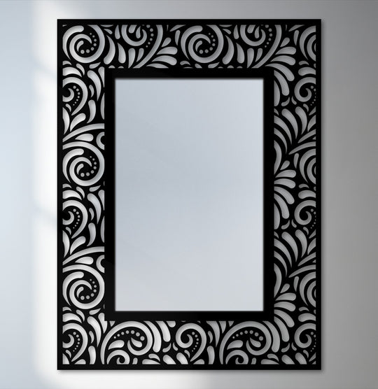 The ornate scrollwork on the black frame highlights this rectangular mirror for wall decor, lending a touch of classic elegance to its overall design.