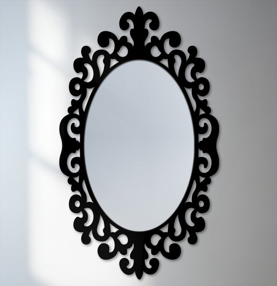 The darkest area defines the intricate scrollwork frame of this Imperial scroll accent oval floor modern mirror, casting a bold silhouette against the mirrored glass.