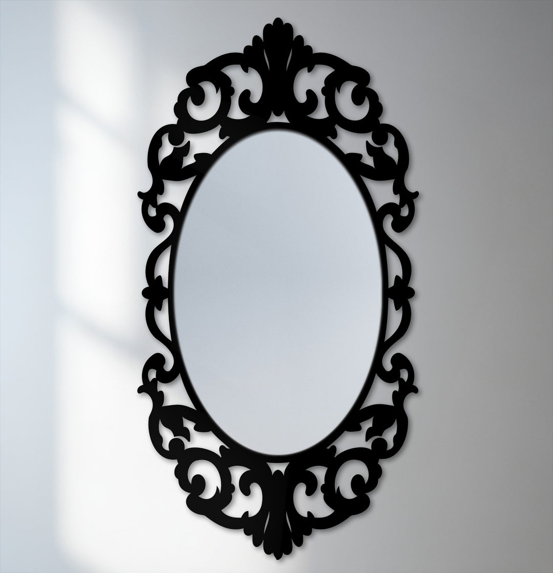 Low color saturation emphasizes the dark, ornate flourishes of this vintage oval floor mirror, an elegant addition to any bathroom mirror decor collection.