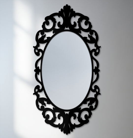 Low color saturation emphasizes the dark, ornate flourishes of this vintage oval floor mirror, an elegant addition to any bathroom mirror decor collection.