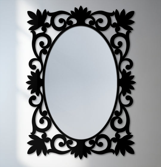 Foreground detail shows the ornate floral scrollwork surrounding this framed wall mirror, creating an elegant accent.