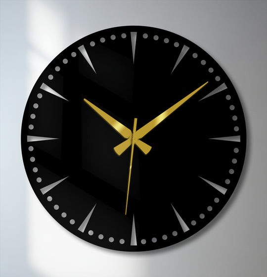 Striking color contrast highlights the black minimalist statement wall clock against the neutral backdrop, showcasing the gold hands as stunning metal art for wall.