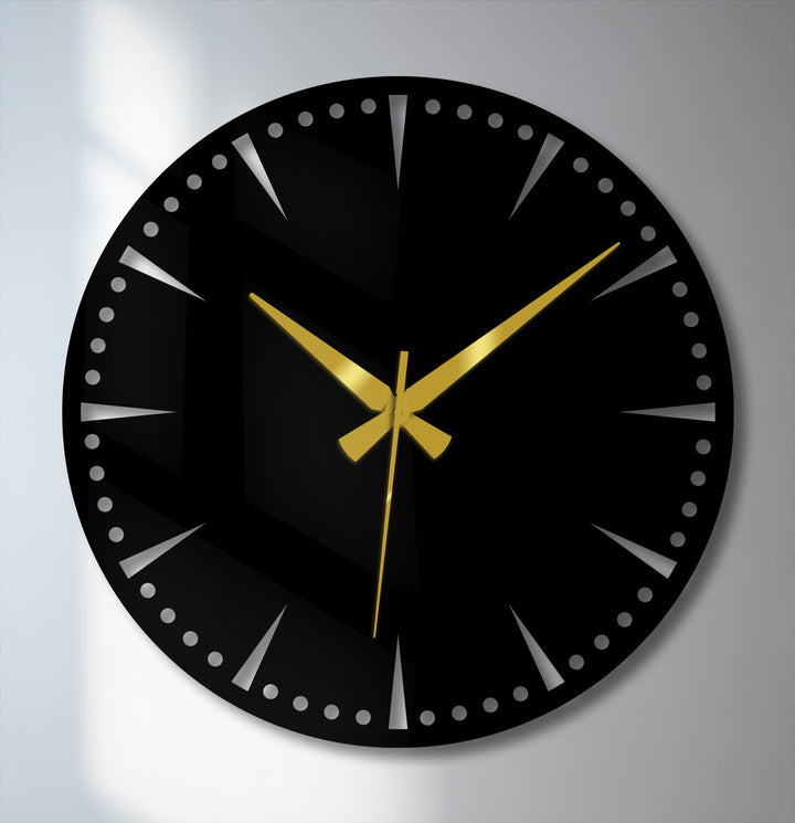 Striking color contrast highlights the black minimalist statement wall clock against the neutral backdrop, showcasing the gold hands as stunning metal art for wall.