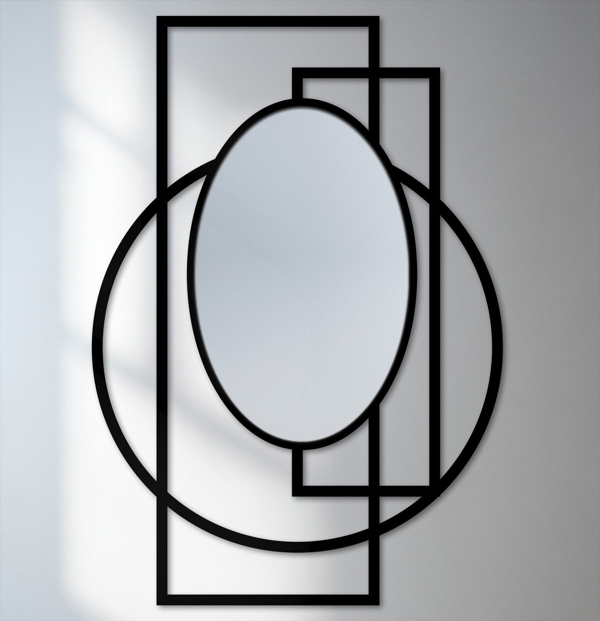 High color contrast emphasizes the black intersected rings and frame of this modern geometry statement bathroom mirror against the light background.