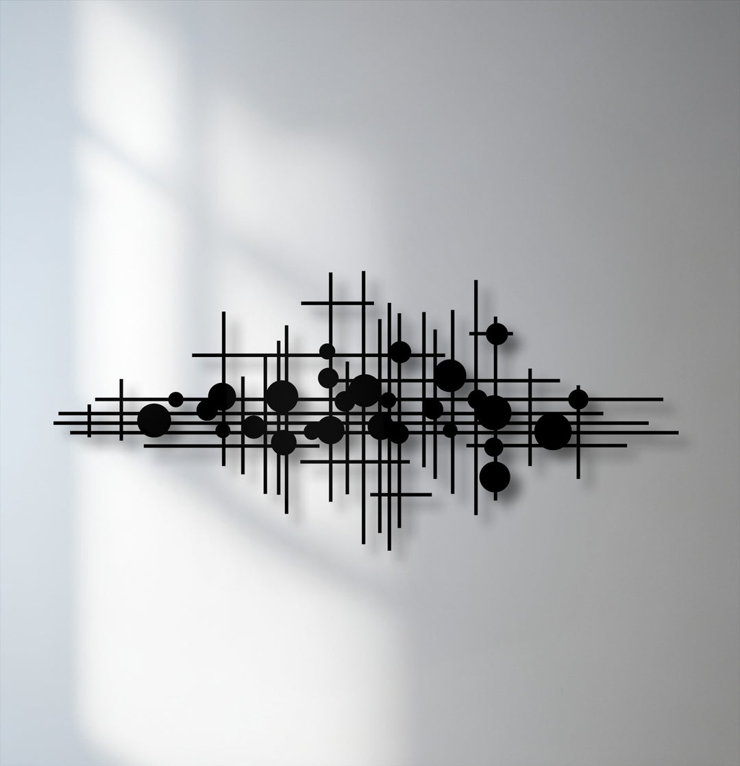 The intricate shadows cast by the geometric lines metal artwork create a striking abstract modern decor effect on the bright wall.