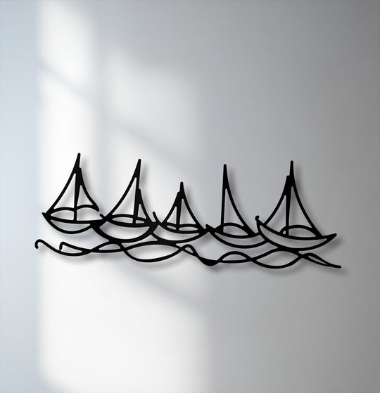 The visual rhythm of five black sailboat silhouettes riding continuous waves creates a captivating decoration wall art piece.