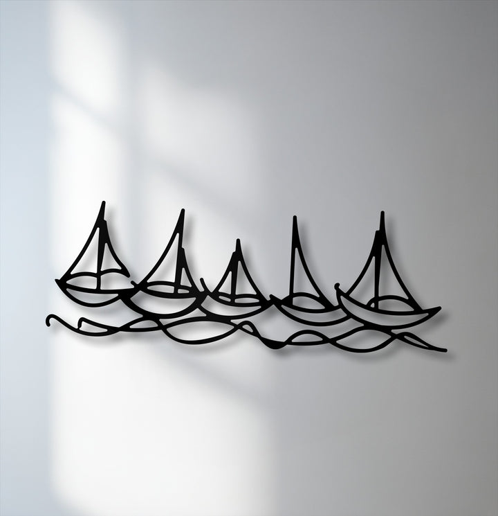 The visual rhythm of five black sailboat silhouettes riding continuous waves creates a captivating decoration wall art piece.