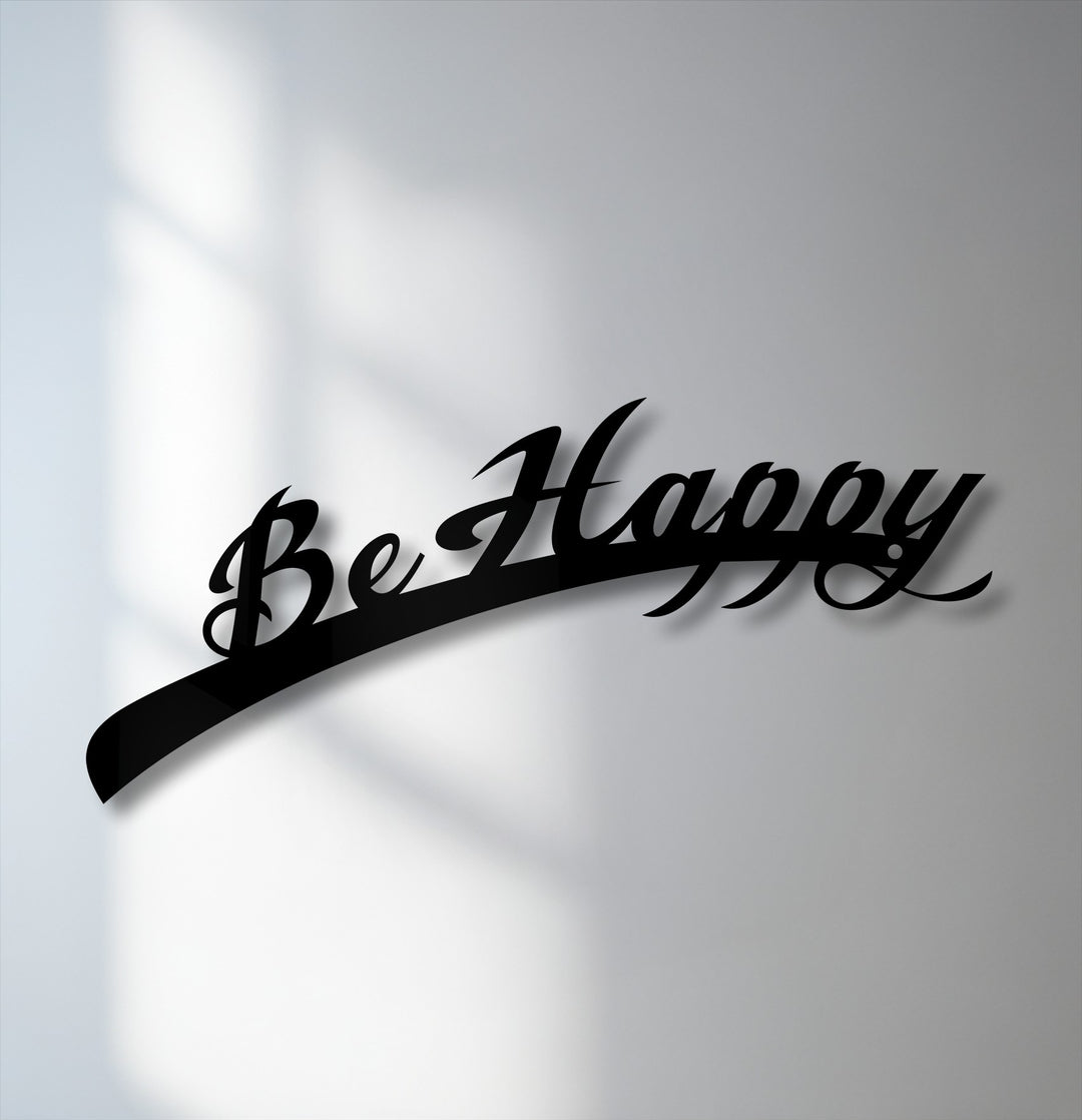 The sweeping script of the 'Be Happy' inspirational quote metal artwork creates a dynamic visual rhythm against the illuminated wall.