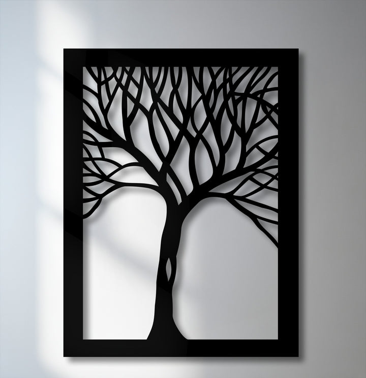The matte black finish of this abstract tree silhouette decorative metal art creates striking depth and shadow effects on the wall.