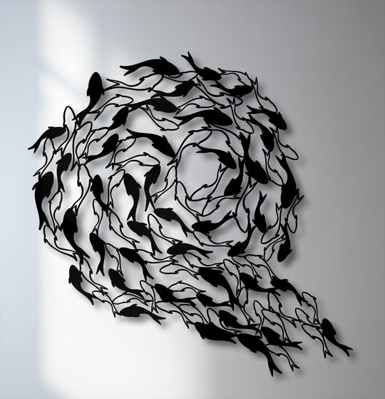 The brightly illuminated white wall provides a stark contrast, enhancing the unique metal wall art of a flowing koi fish circle.