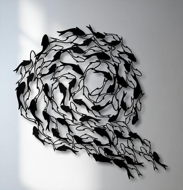 The brightly illuminated white wall provides a stark contrast, enhancing the unique metal wall art of a flowing koi fish circle.