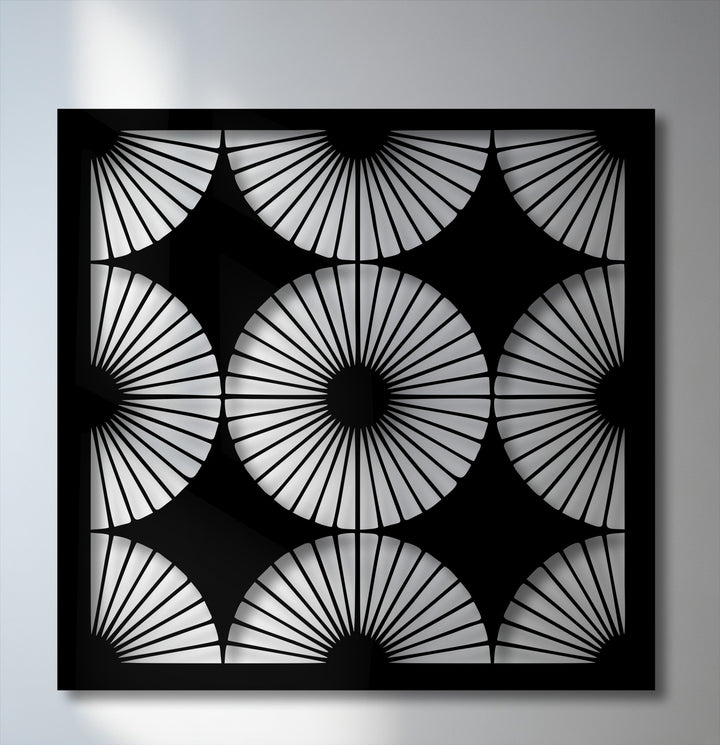 The neutral color temperature highlights the intricate black geometric fan pattern of this metal wall art, a striking decoration wall art piece.