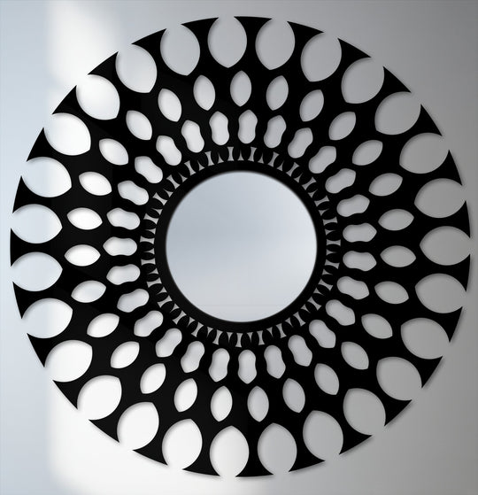 Negative space highlights the radial pattern in this decorative mirror, creating a modern and artistic design for your wall.