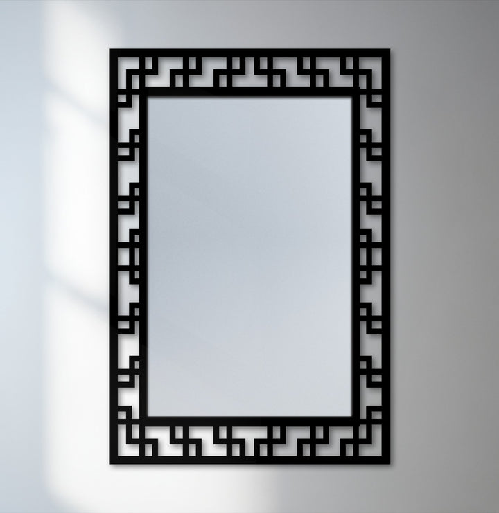 The focal point of this geometric maze pattern floor mirror showcases its sleek, modern design as a piece of unique metal wall art.