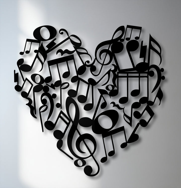 The intricate arrangement of black music notes and symbols forming a heart is the focal point of this metal art for wall.