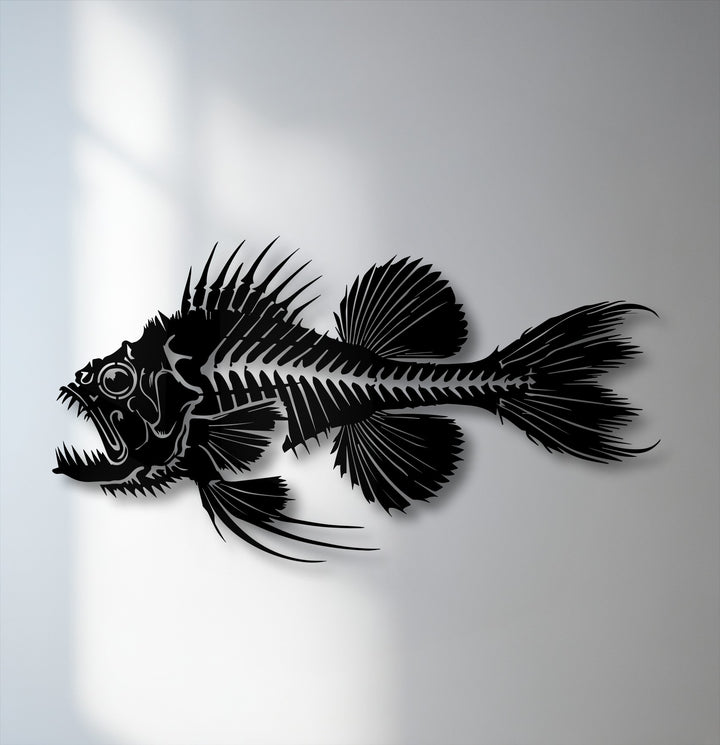 Horizontally oriented, this detailed silhouette of a predatory fish skeleton makes striking metal art for wall decor.