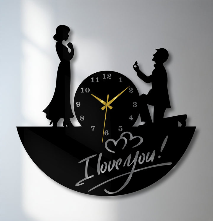 Expressing a tender ambiance, the love proposal metal wall clock showcases a couple silhouette, ideal decoration wall art for romantic moments and gifting.