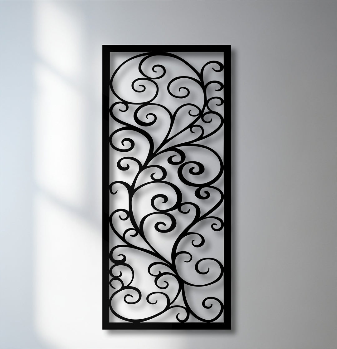 The ornate scroll pattern of the black metal wall decor features elegant swirls and intricate branches.