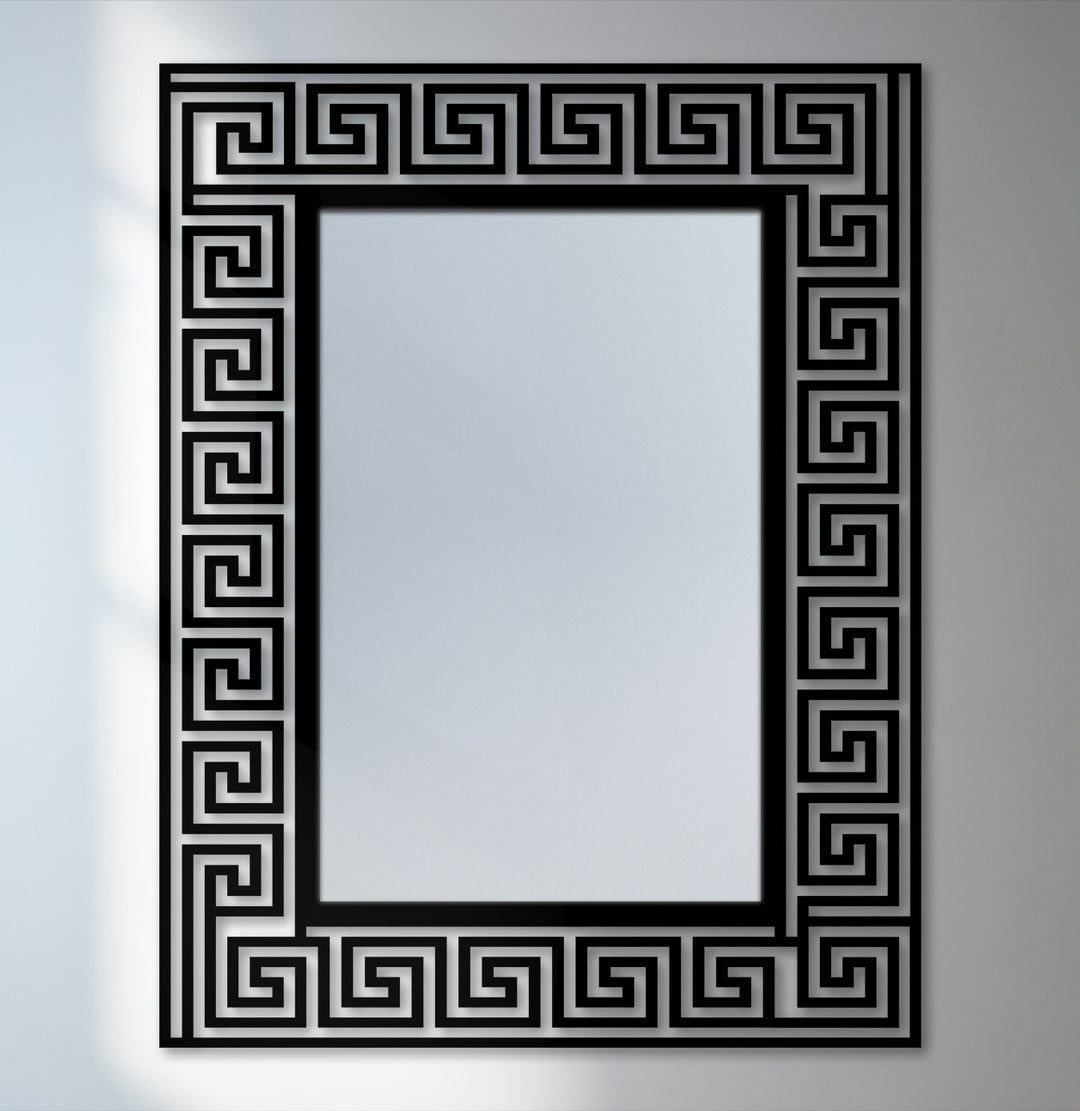 Intricate layering emphasizes the black metal decorative metal art frame with a Greek key pattern surrounding this elegant bathroom mirror.