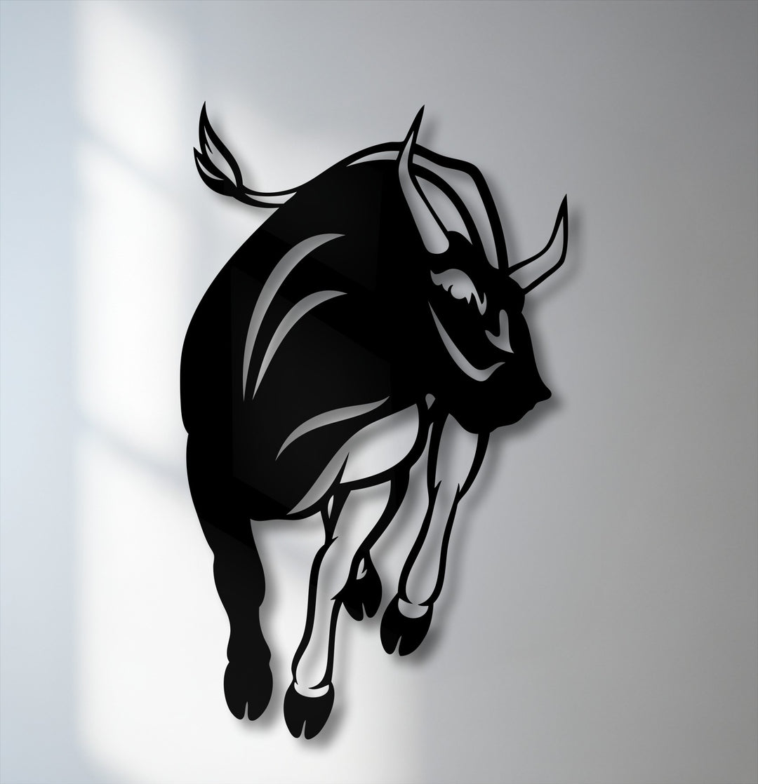The dynamic silhouette of a charging bull features a bold geometric design with sharp angles and fluid curves, making striking metal artwork.