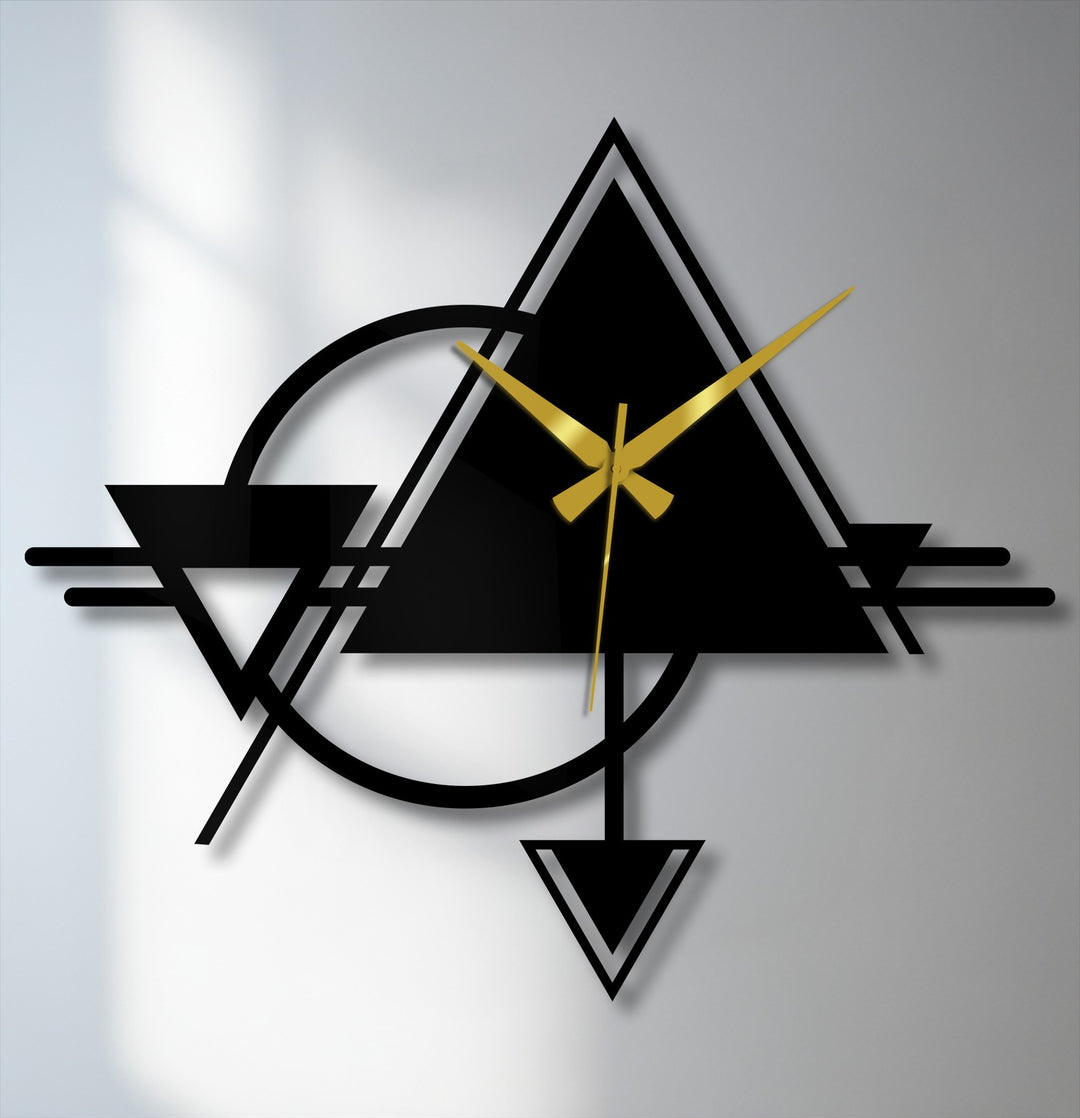 Frozen in time, the abstract triangle and circle geometric metal artwork offers a still moment of modern design, showcasing its bold lines and golden hands.