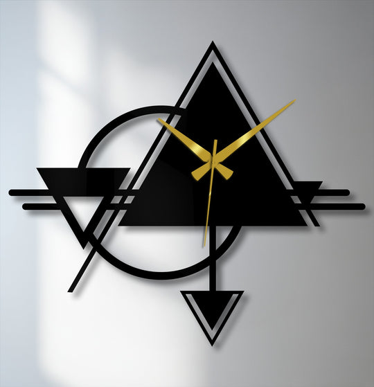 Frozen in time, the abstract triangle and circle geometric metal artwork offers a still moment of modern design, showcasing its bold lines and golden hands.