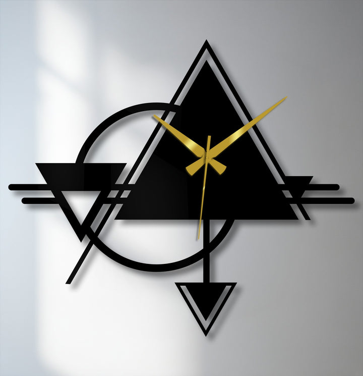 Frozen in time, the abstract triangle and circle geometric metal artwork offers a still moment of modern design, showcasing its bold lines and golden hands.