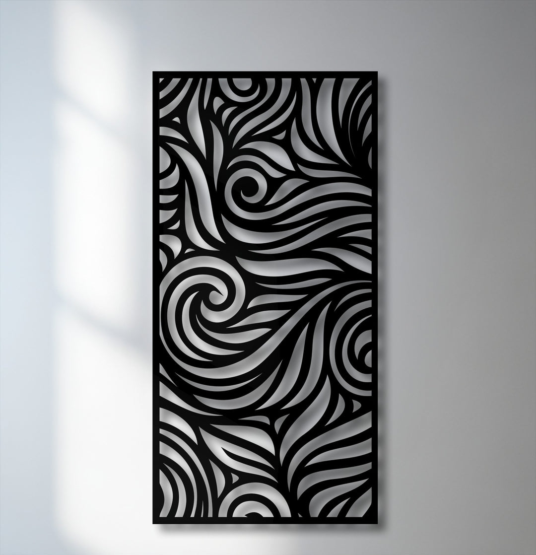 The background shows a white wall with faint window shadows on the left, transitioning to a gray surface behind the decorative metal art.