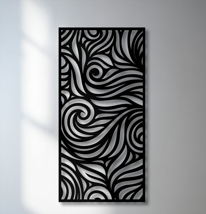 The background shows a white wall with faint window shadows on the left, transitioning to a gray surface behind the decorative metal art.