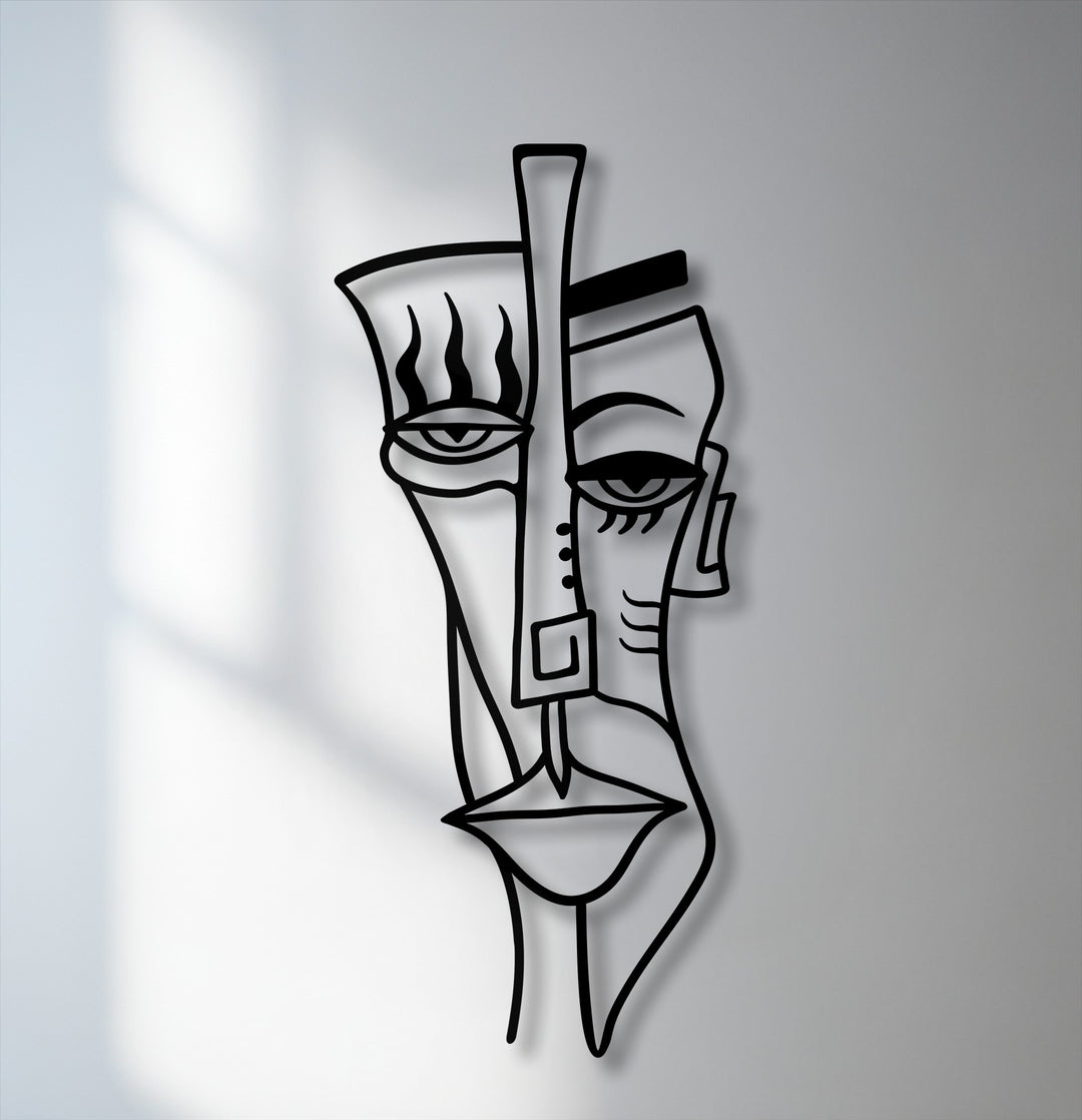 Capturing the abstract quality, this unique metal wall art depicts a cubist tribal face with bold lines and striking shadow play.