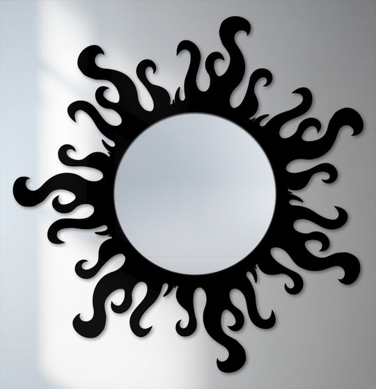 Negative space creates striking flame patterns around the round mirror's edge, highlighting this modern asymmetrical stained glass wall mirror.