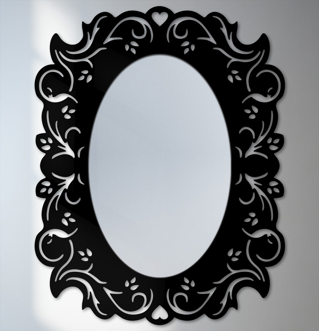 Elegant black framed wall mirror featuring a romantic floral design in an oval shape that makes a great piece of framed wall mirror home decor.