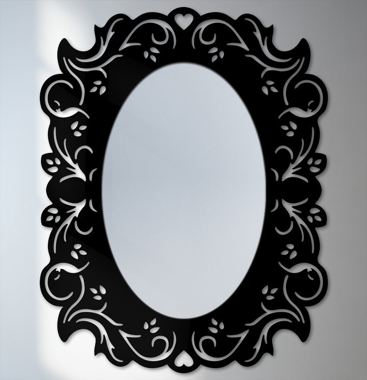Elegant black framed wall mirror featuring a romantic floral design in an oval shape that makes a great piece of framed wall mirror home decor.