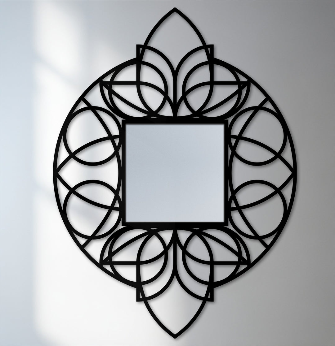 The brightest area highlights the geometric floral black metal frame of this unique metal wall art floor mirror, creating a striking focal point.
