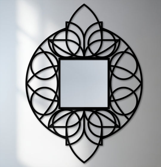 The brightest area highlights the geometric floral black metal frame of this unique metal wall art floor mirror, creating a striking focal point.