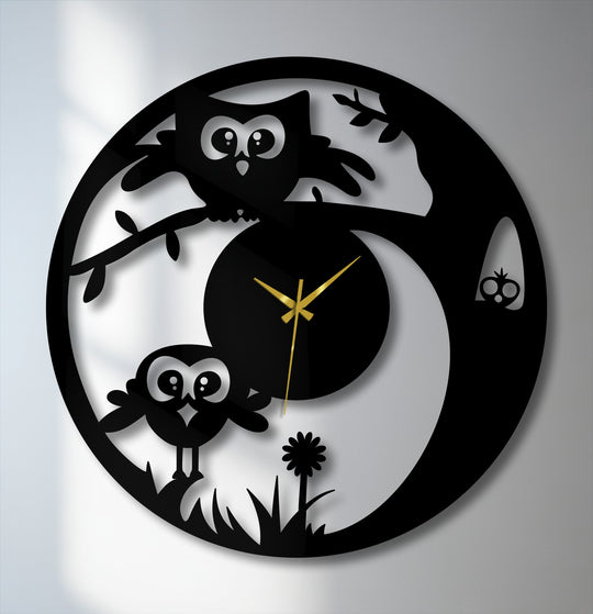 Light and shadow define the playful nature design of this cute owl metal art for wall clock, casting subtle depth on the whimsical tree and owl silhouette.