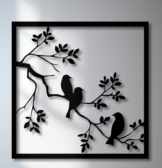 A cool color temperature enhances this striking metal artwork, showcasing three minimalist birds perched on branches within a sleek frame.