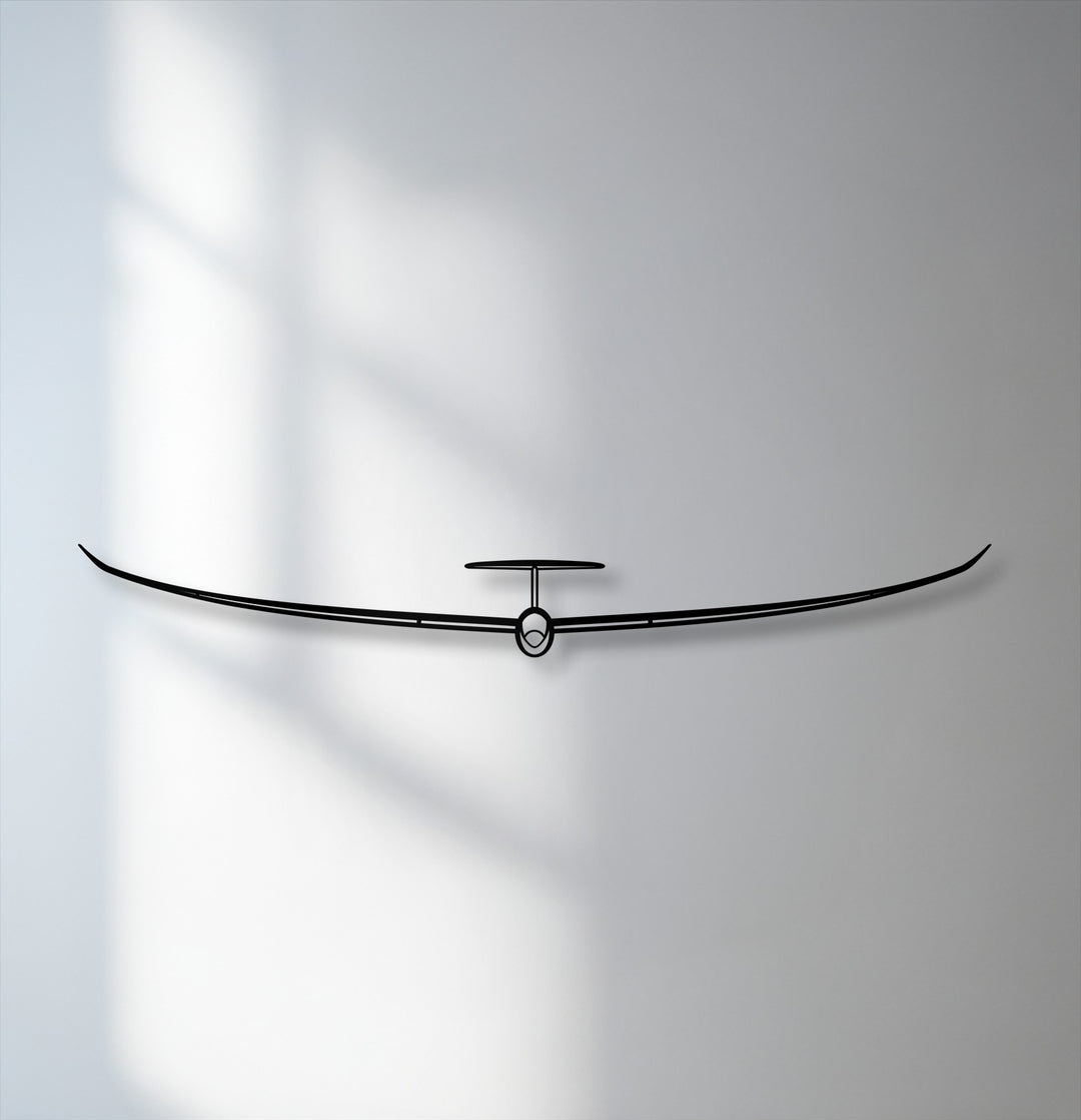 The stark black silhouette of the minimalist glider metal art for wall offers a striking color contrast against the subtle grey-white backdrop.