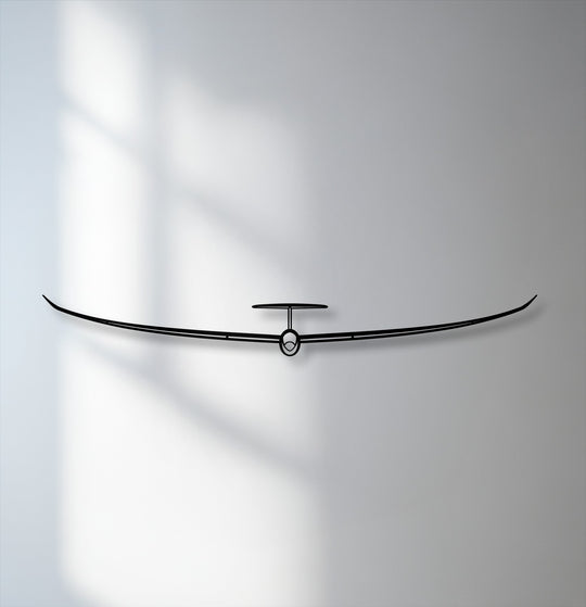 The stark black silhouette of the minimalist glider metal art for wall offers a striking color contrast against the subtle grey-white backdrop.