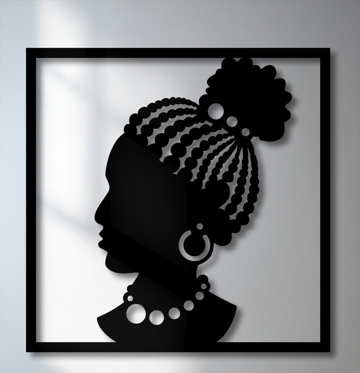 Predominantly black, this unique metal wall art features an elegant African woman silhouette with intricate braided hair and jewelry.
