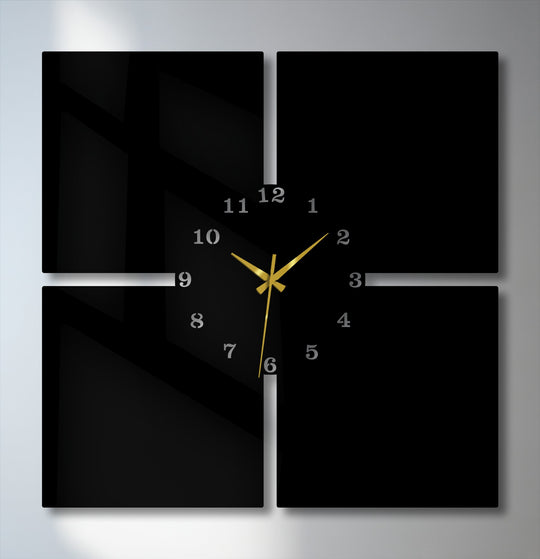 Crisp edges and panel borders define this modern 4-piece metal wall clock, a sleek black decoration wall art with gold hands.