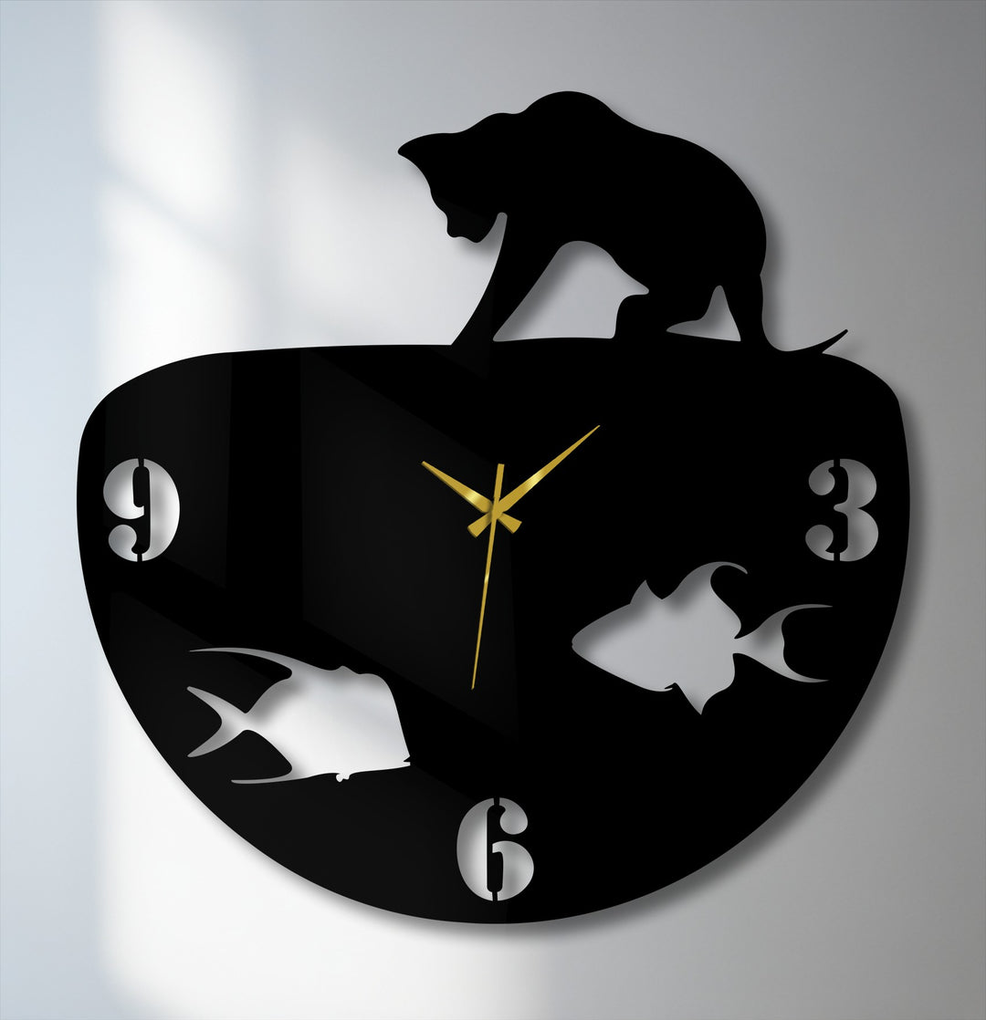 The geometric design of this decorative metal art wall clock features a curved body with a cat silhouette, plus numeric and fish cutouts.