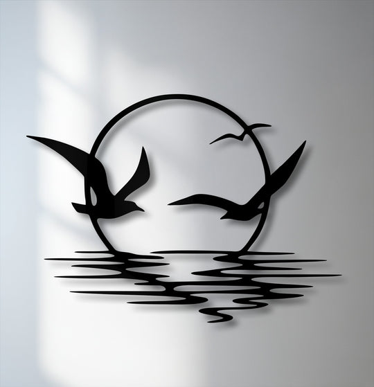 Soaring seagulls dynamically glide around a setting sun above rippling waves, creating a captivating metal decoration wall art piece.