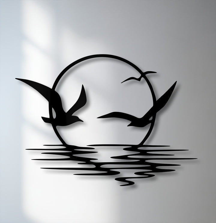 Soaring seagulls dynamically glide around a setting sun above rippling waves, creating a captivating metal decoration wall art piece.